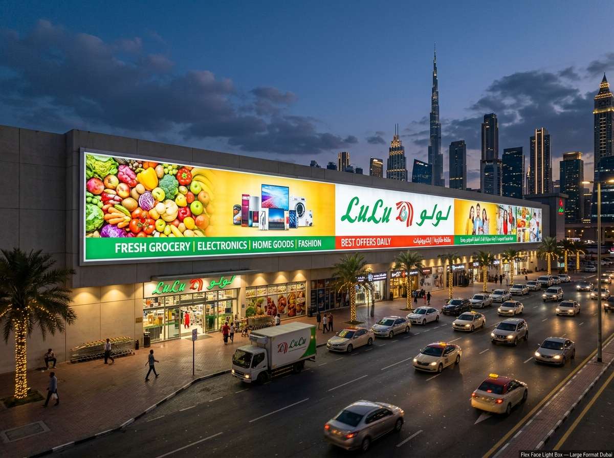 Wide flex face light box sign spanning a Dubai supermarket shopfront